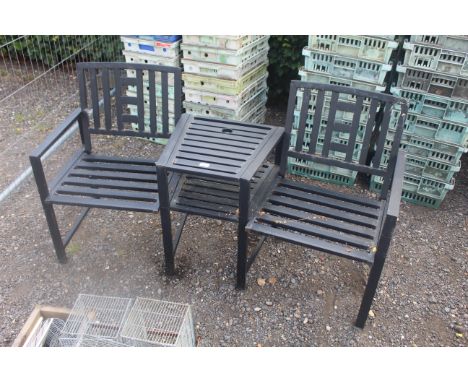 A two seater metal framed garden bench with fitted central two tier table