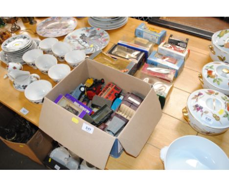 A quantity of boxed and un-boxed toy/model vehicles