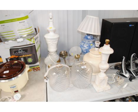 An Oriental blue and white 'Prunus' patterned table lamp and shade, a white glazed table lamp, two others, a ceiling lamp etc