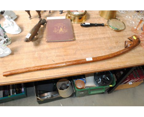 A rustic carved walking stick
