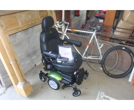 A Rascal Ryley & Rivco Powerchair series wheelchair with joy stick, 5 speed control, two battery chargers, tool kit, owners m