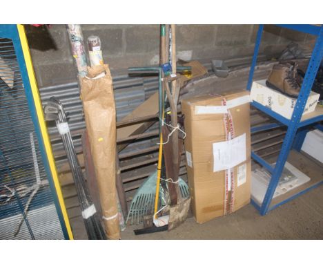 A quantity of gardening tools to include digging fork, broom, rake, paint roller, hand saw etc.
