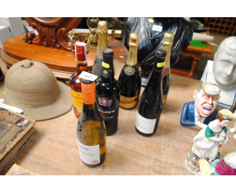 A bottle of Taylors Reserve port, a bottle of Spanish brandy, three bottles of sparkling wine and two table wines