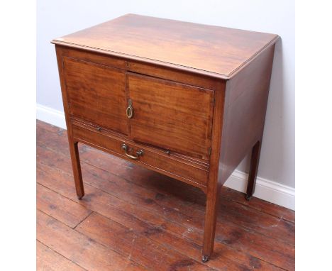 A 19th century stained mahogany night stand, of rectangular form with hinged top enclosing basin receptacles, above a pair of