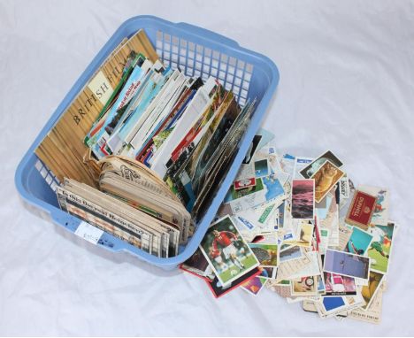 A mixed selection of postcards including saucy seaside cards and cigarette cards, assorted beer mats and a replica 'death pen