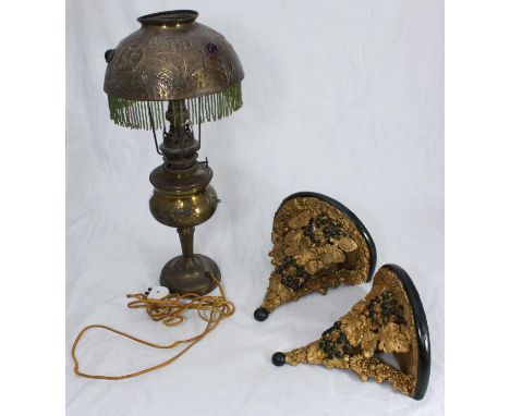 A Victorian brass oil lamp converted to a lamp with brass jewelled and fringed shade, approx. 46cm high, together with a pair