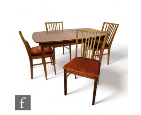 Vanson - A mid Century teak extending dining table with tapered block supports, one extra leaf, together with a set of four V