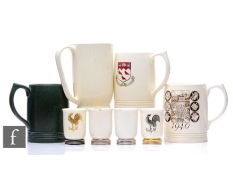 Keith Murray - Wedgwood - A collection of four tankards, to include an example with a green matte glaze, one with a roundel d