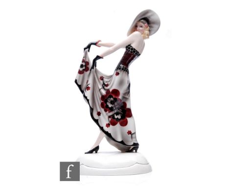 Stefan Dakon - Goldscheider - A large Art Deco figure modelled as a fashionable lady in walking pose and stylised floral gown
