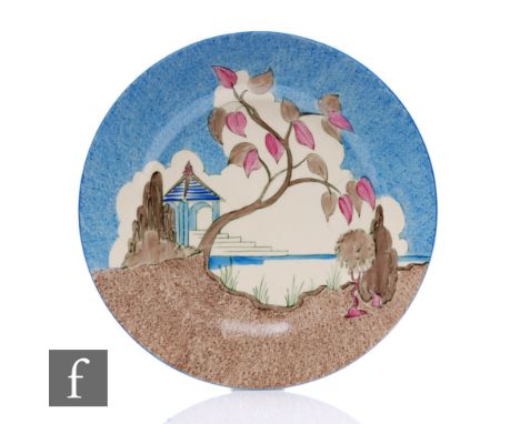 Clarice Cliff - Blue Japan - A circular plate circa 1934, hand painted with a stylised landscape with a pagoda by a lake with