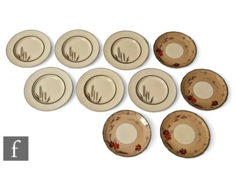 Clarice Cliff - Golden Wheat - A set of six tea plates circa 1938, transfer printed in gold with stylised ears of corn over a