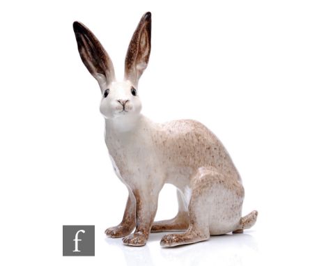 Winstanley - A ceramic sculpture of an Arctic hare, glazed in mottled brown with glass eyes, size 8, painted marks, height 38