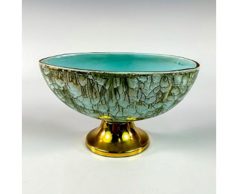 Turquoise with lustre finish and branch patterning. Gold toned rim. Golden Delftware sticker on exterior."Hand Painted Delftw