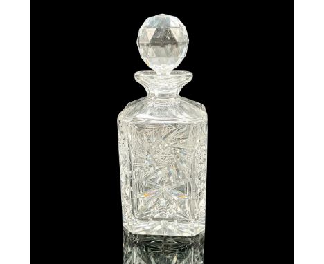 Beautiful clear crystal decanter with etched pinwheel design embellished with fan and diamond cuts. This item has its origina