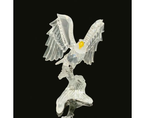 This retired bald eagle bird figurine is made from faceted clear and frosted smooth crystal. It has a light topaz beak and bl