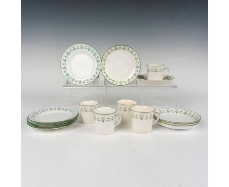 A set of five cups, saucers, and tea plates. White with green trims and decorated in a green floral garland pattern. Foley EB