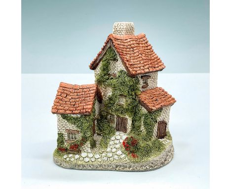 This handmade and hand painted David Winter figure depicts an Ivy-covered Cottage. This item has its original box: 4.5"L x 6"