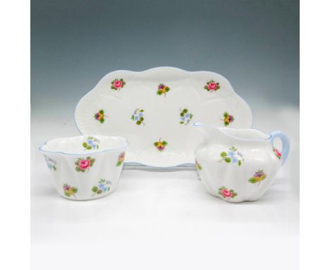 Includes tray, creamer and sugar bowl that has delicate design of blue and pink floral bunches with light blue trim on edges 