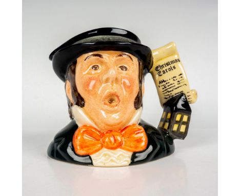 Glaze finish in black, white, and blue coloration. Sheet music and lantern handle. Royal Doulton backstamp. Artist: Martyn C.