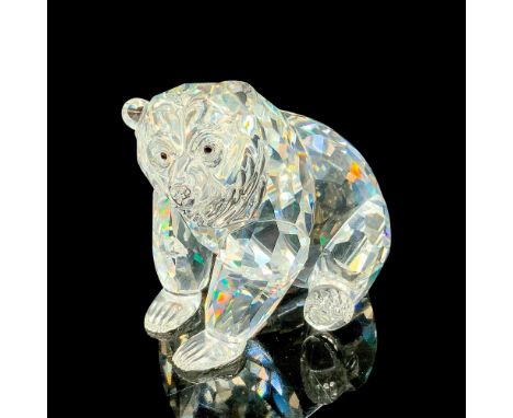 This retired grizzly bear figurine has a clear facetted body and a molded crystal head. Swarovski acid stamp on bottom. The b