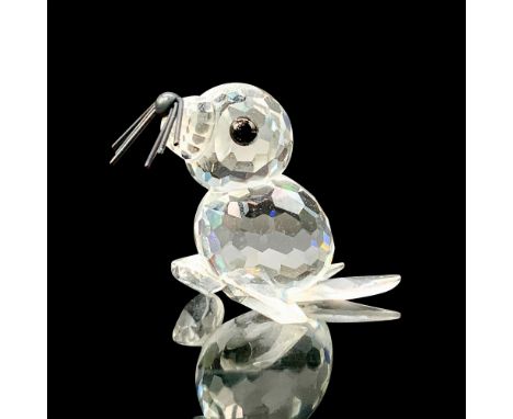A clear crystal figure of a baby seal on all four flippers with black crystal eyes and black metal whiskers. Swarovski backst