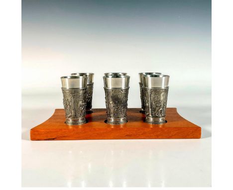 Highly detailed shot glasses featuring scene of people working in the country in a relief. Marked 'Feinzin' as the marker to 