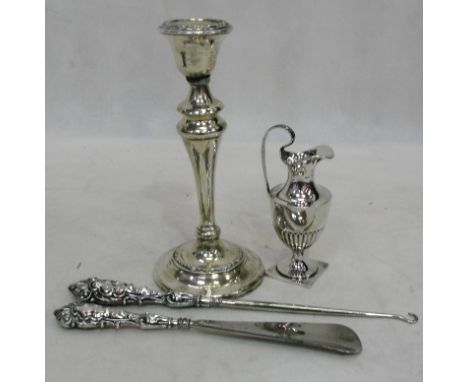 A HM silver shoe horn; together with a button hook, ewer and candlestick