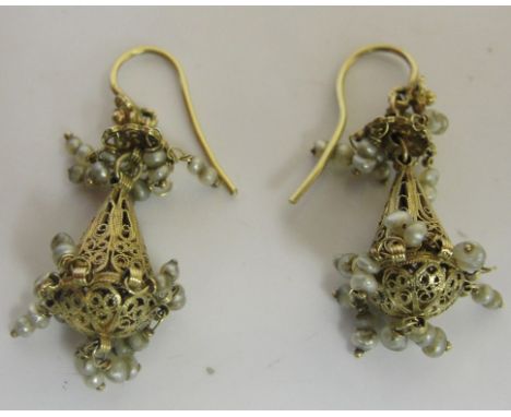 A pair of early 20th C Filigree chandelier earrings set with seed pearls