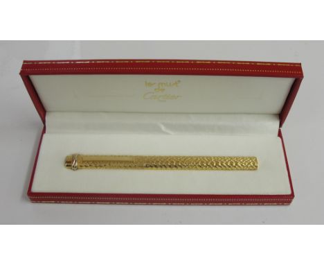 A boxed Must De Cartier gold plated ballpoint pen with certificate