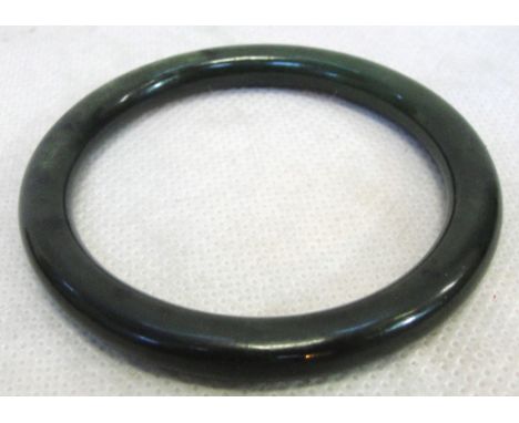 A nephrite jade bangle, c1930