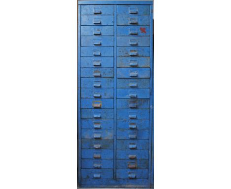 AN EARLY 20TH CENTURY METAL CABINET OF 34 DRAWERS, some still containing tools, nuts, bolts etc, 64cm x 166cm