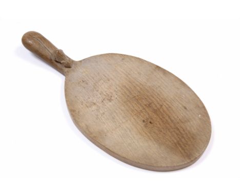 ROBERT THOMPSON of Kilburn (1876-1955) A Mouseman oak cheeseboard, 37cm wide 