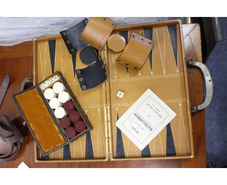 A FORTNUM & MASON LEATHER CASED BACKGAMMON SET by Jaques, the case 37cm wide 