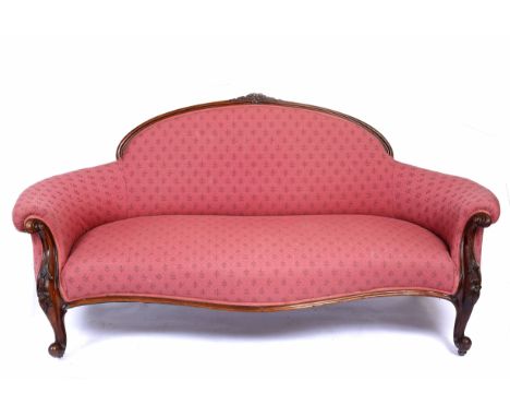 A 19TH CENTURY MAHOGANY FRAMED SOFA with arching back, carved scrolling legs 186cm wide 