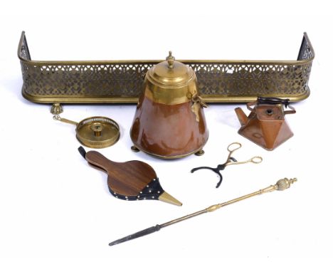 A PIERCED BRASS FENDER, 124cm long; a copper and brass milk churn; a copper kettle; a brass poker, tongs, chamber stick and b