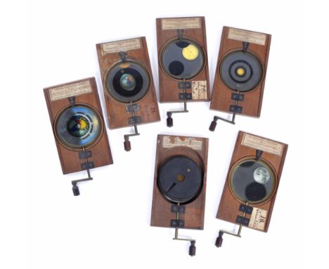 A GROUP OF VICTORIAN AUTOMATON MAGIC LANTERN SLIDES by Carpenter & Westley 24 Regent Street, showing solar eclipses etc. (6)
