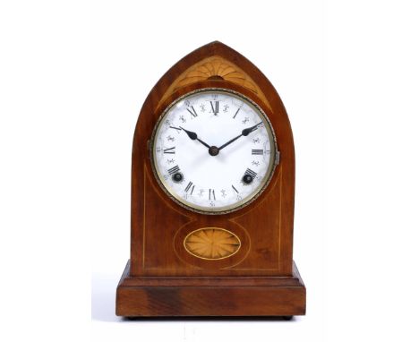 AN EDWARDIAN LANCET CASE STRIKING MANTLE CLOCK, 32cm high; and a mahogany revolving bookcase, 45cm square (2)
