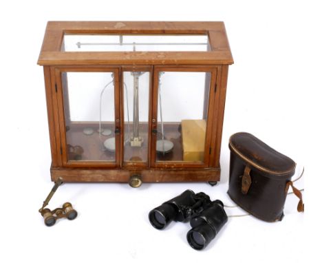 A SET OF BALANCE SCALES in oak case with weights, case measures 51cm x 43cm, a pair of Regent military binoculars and a pair 