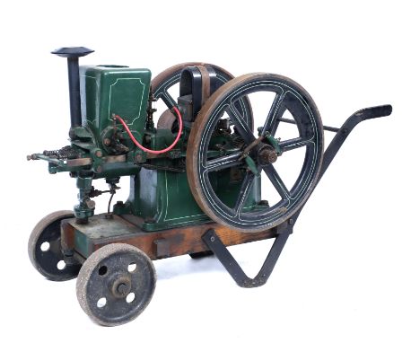 AN EARLY 20TH CENTURY AMANCO 'HIRED MAN' 2 1/4HP STATIONARY ENGINE on wheeled trolley