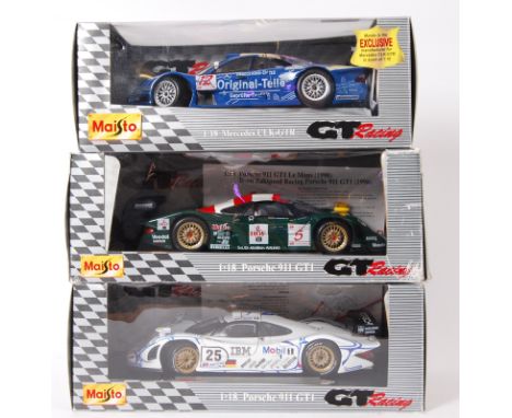 MAISTO: A collection of 3x Maisto 1:18 scale diecast model ' GT Racing ' cars. Mercedes CLK-GTR and 2x Porsche 911's. All wit