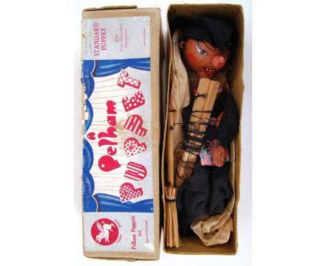 PELHAM PUPPET: An early Pelham Puppet ' Witch ,' within an early buff coloured box with paper label to top. Hand painted head