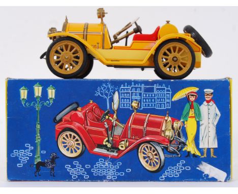 SCHUCO: A Schuco tinplate ' Old Timer ' clockwork model car. Within the original box. Mint, and appearing unused. Complete wi