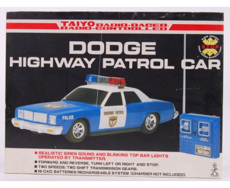 DODGE HIGHWAY PATROL: An original vintage 1980's Taiyo Radio Racer RC car ' Dodge Highway Patrol '. Mint, in the original box