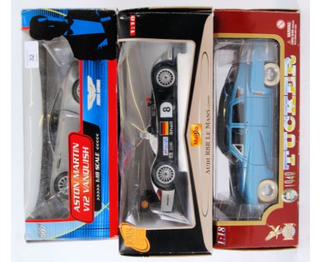 1:18 SCALE: A collection of 3x 1:18 scale boxed diecast models to include a James Bond 007 Aston Martin Vanquish, Maisto Audi