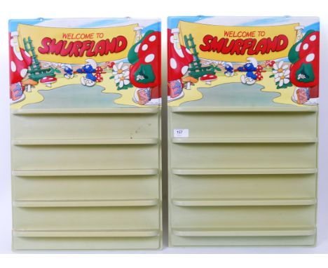 SMURFS: A pair of vintage Peyo made Smurfland display shelves. Made of heat formed plastic, both with decorative Smurf panels