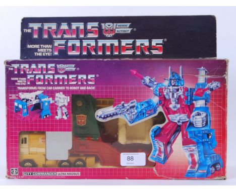 TRANSFORMERS: A vintage G1 Transformer ' Ultra Magnus ' action figure, within the original box. Does appear to be complete wi