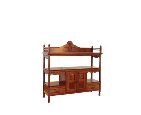 BOMBAY SCHOOL OF ART: A TEAK SIDEBOARD, rectangular top with gallery rail and carved back, below a single open-shelf, two pan