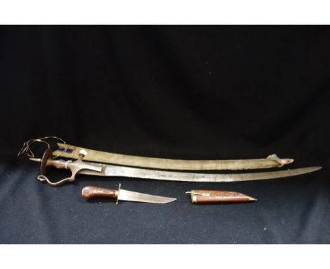 A STEEL SWORD with a velvet covered scabbard and a wooden cased dagger (2)