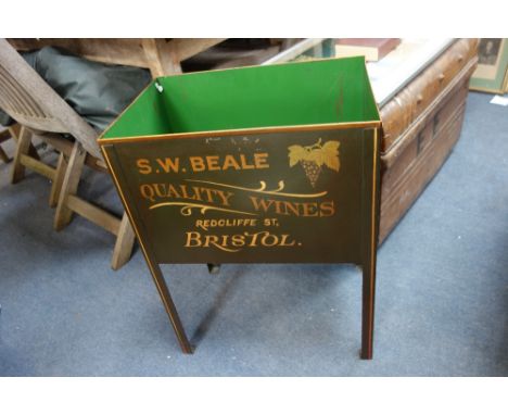 A PAINTED TIN WINE BOTTLE BIN and a tin trunk (2)