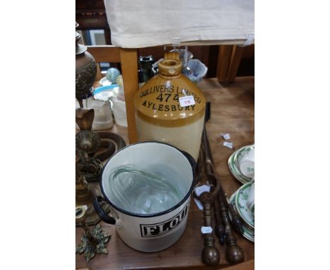 A STONEWARE FLAGON 'Gullivers Ltd, Aylesbury', two pairs of steel fire irons, an enamel flour bin and a glass rabbit jelly mo